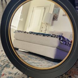 27 in round 
Black a d gold metal frame