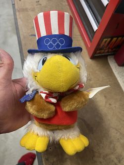 vintage 1980s Sam the Olympic Eagle plush toy, the mascot for the 1984 Los Angeles Summer Olympic Games, often produced by Wallace Berrie & Company or