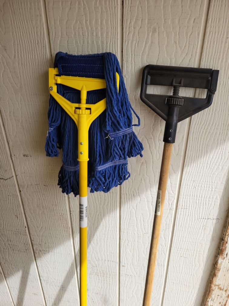 2 mop stick handles 1 has mop head all Brand New $20 for both