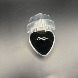 Infinity  Silver toned Bow Ring  with case (New) size 6