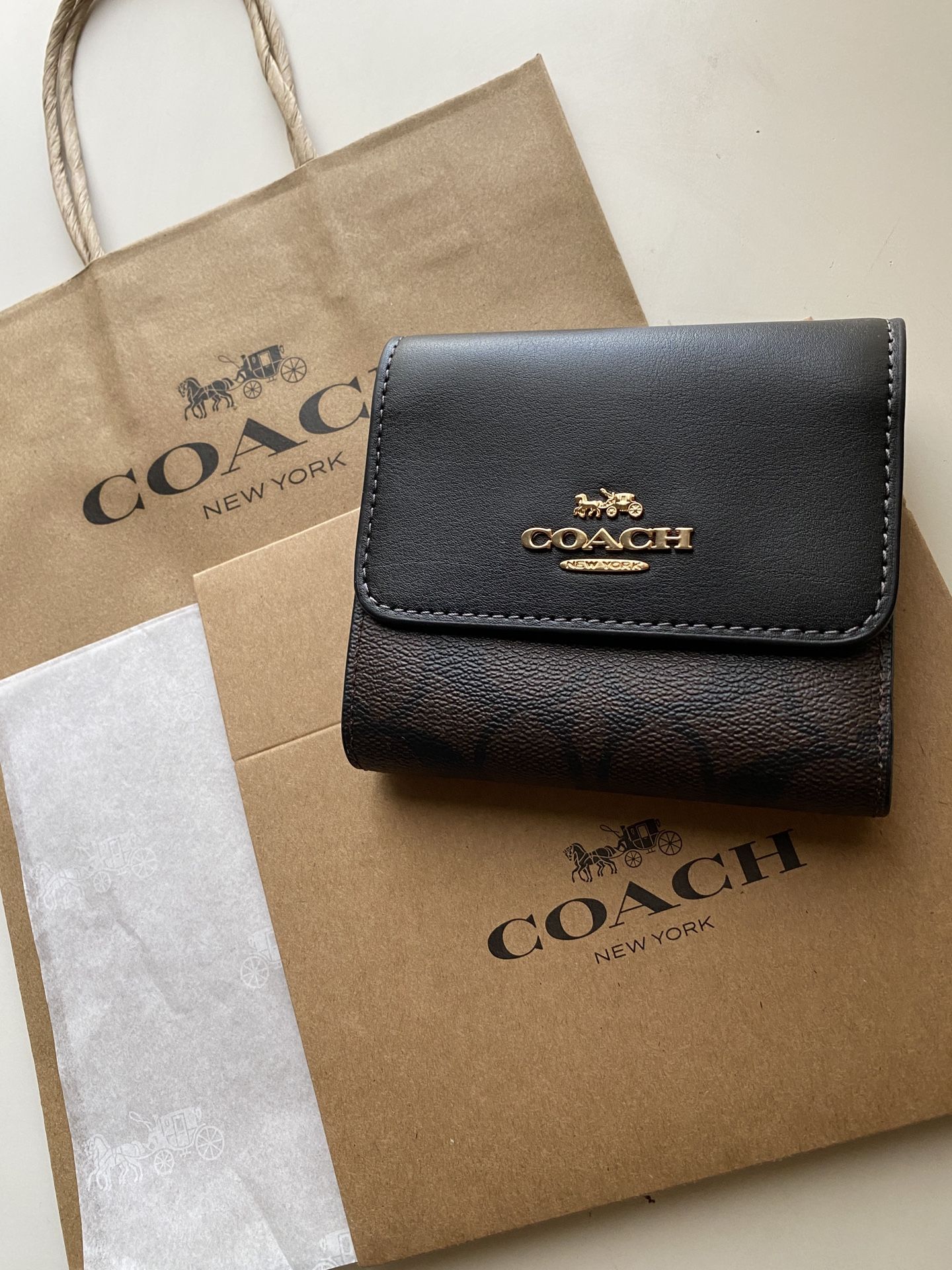 Coach small trifold Wallet in signature Canvas