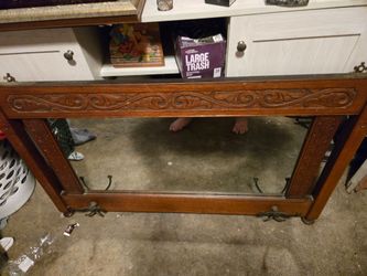 How older vintage wall mirror with co? Rack