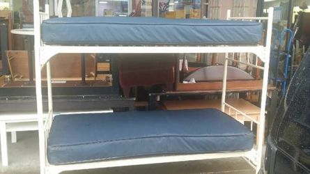 Military or dorm style bunk beds. No ladders or mattresses