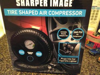 Brand new tire compressor plugs in cigarette lighter