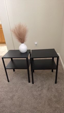 Two short black metal night stands $20