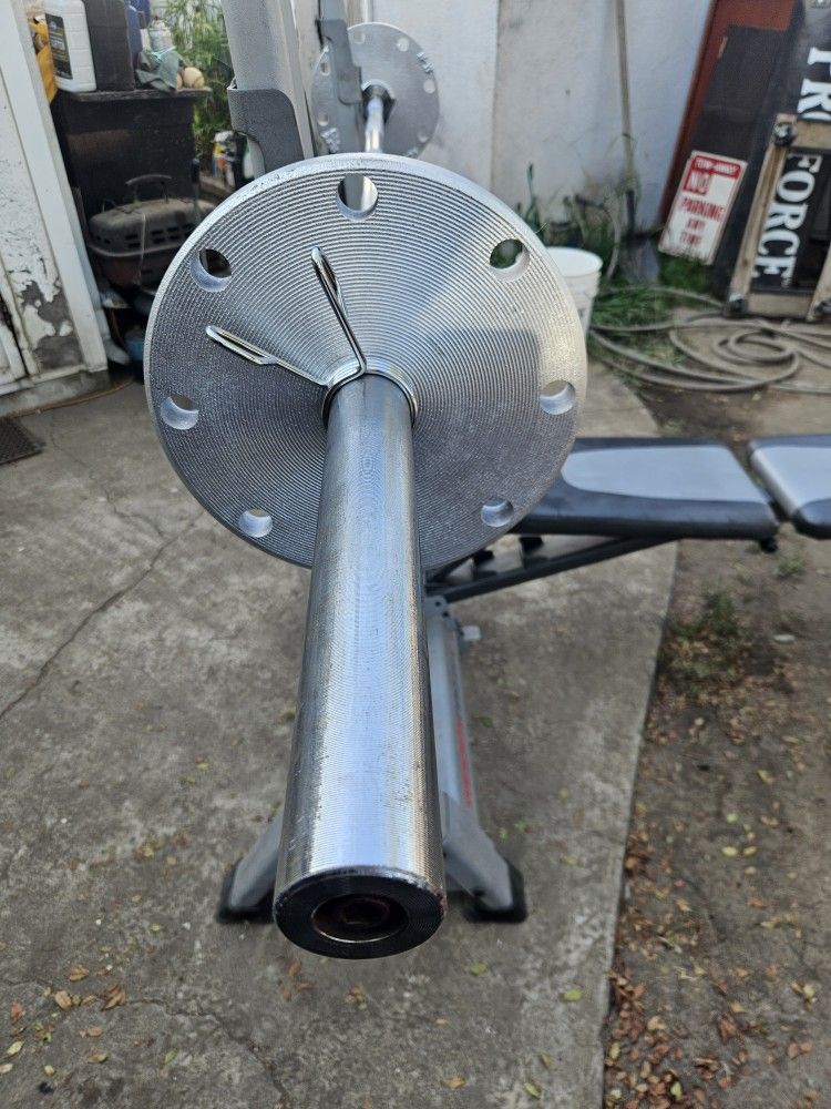 Chrome 7ft 45lb 2 Inch Olympic Barbell with 2x25lb Olympic Plates and locks $100 Total price.
