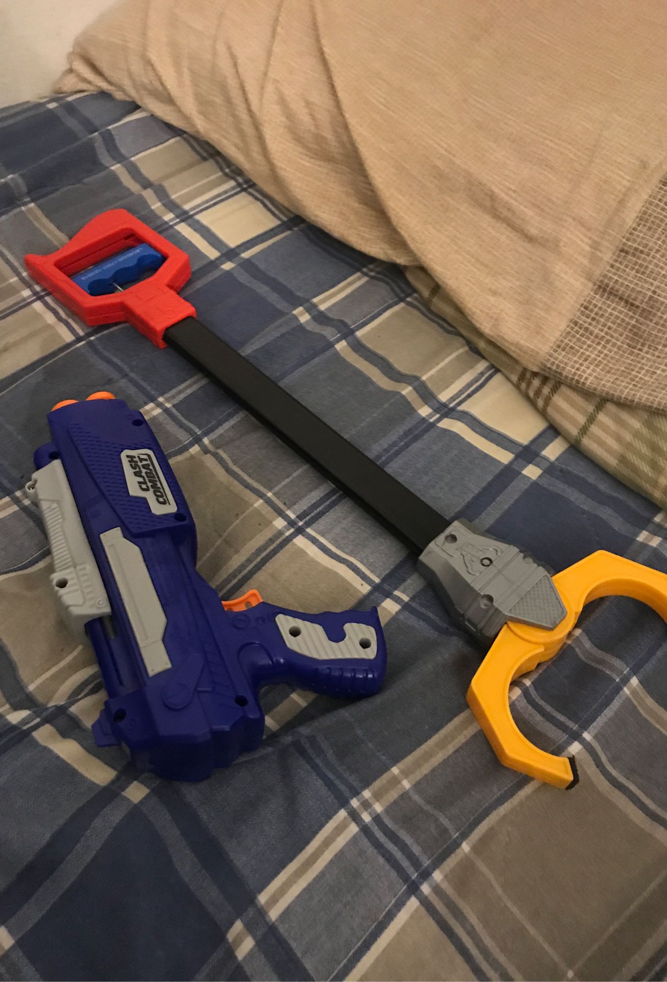 Nerf gun and grabby claw (Nerf bullets not included)