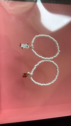 Bracelet ,white , with a charm astronaut and rocket