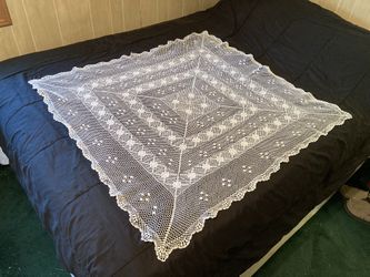 Vintage crocheted tablecloth covering