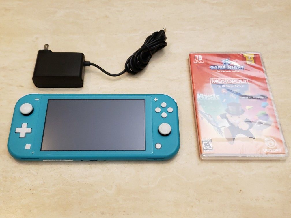 Blue Nintendo Switch Lite With Charger And Monopoly/Risk/Trivial Pursuit $129