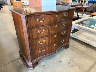 HEIRLOOM HERITAGE FURNITURE Warm Finish Wooden Serpentine Front 4 Drawer Dresser with Swing Pulls and Carved Wood