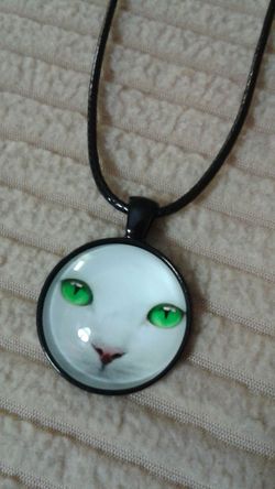 Cat pendant, leather necklace
