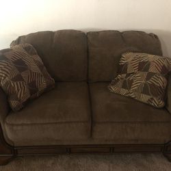 Brown couch with pillows