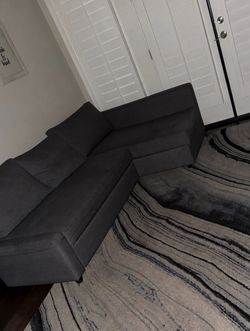 IKEA couch and blue marble rug