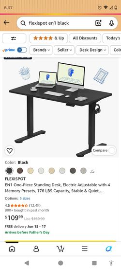 black standing desk with electric motor