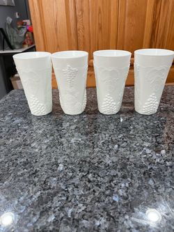 Vintage Milk Glass Harvest Grape Tumblers set of 4. Size approximately 6 inches tall. Preowned Excellent condition. Has been in display in a cabine