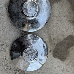2 VW bus hubcaps