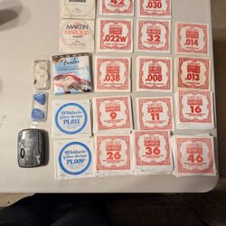 Assorted Electric Guitar Strings And Accessories 