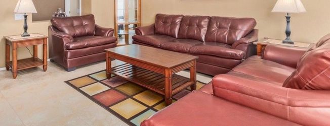 Living room set for sale – includes a couch (like new), center table, and two side tables. The center table has minor wear from normal use. Priced to