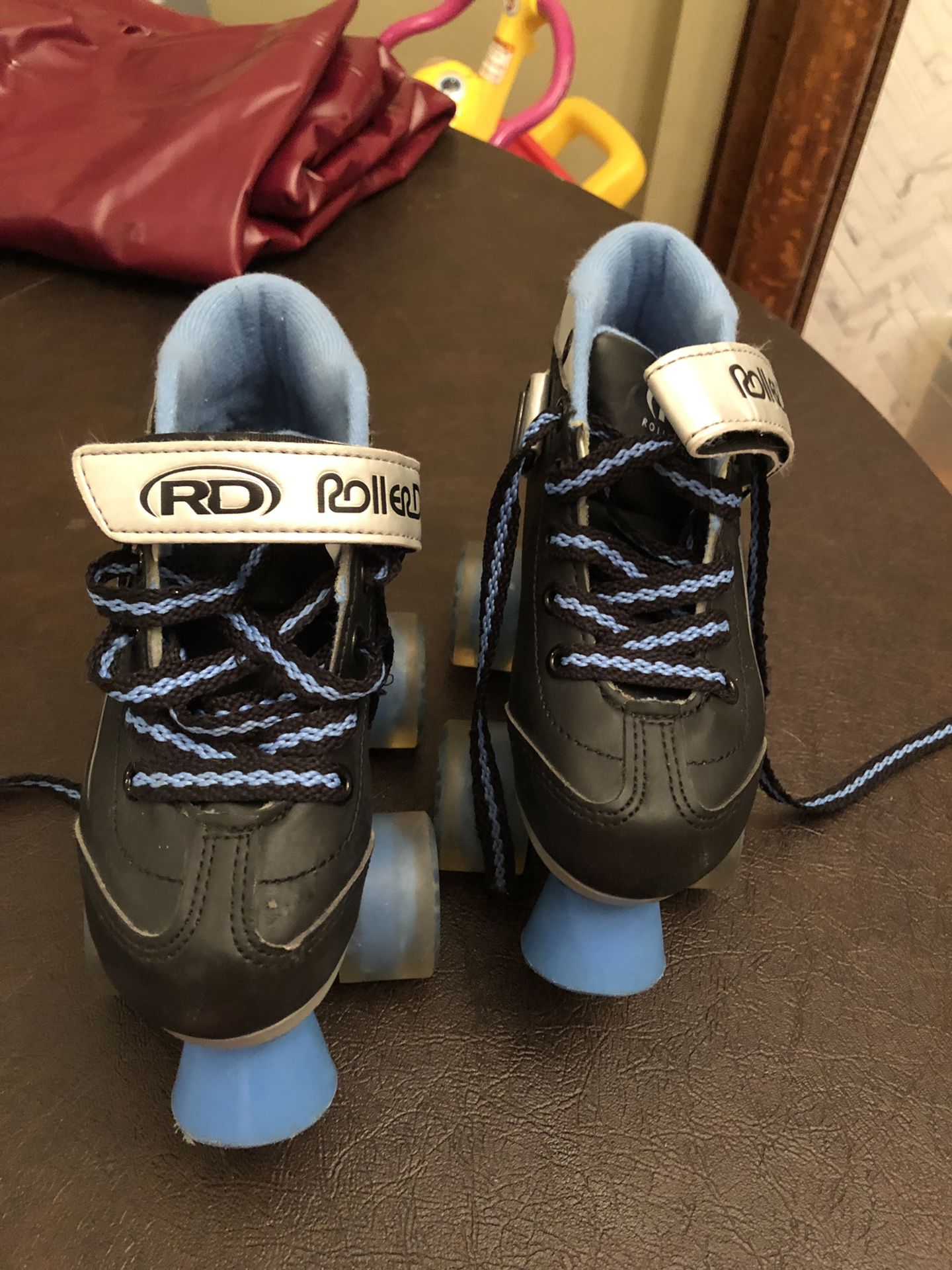 Roller Derby Roller Skates, kid size 13. We have wrist and elbow guards too.