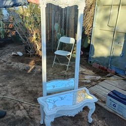 white shabby chic or distressed French-style floor mirror and matching coffee table