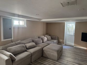 Large grey 6 seater sofa with ottoman