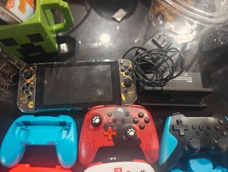 nintendoswitch version one with screen protector and case and travel bag and other mod and accessories controllers and such