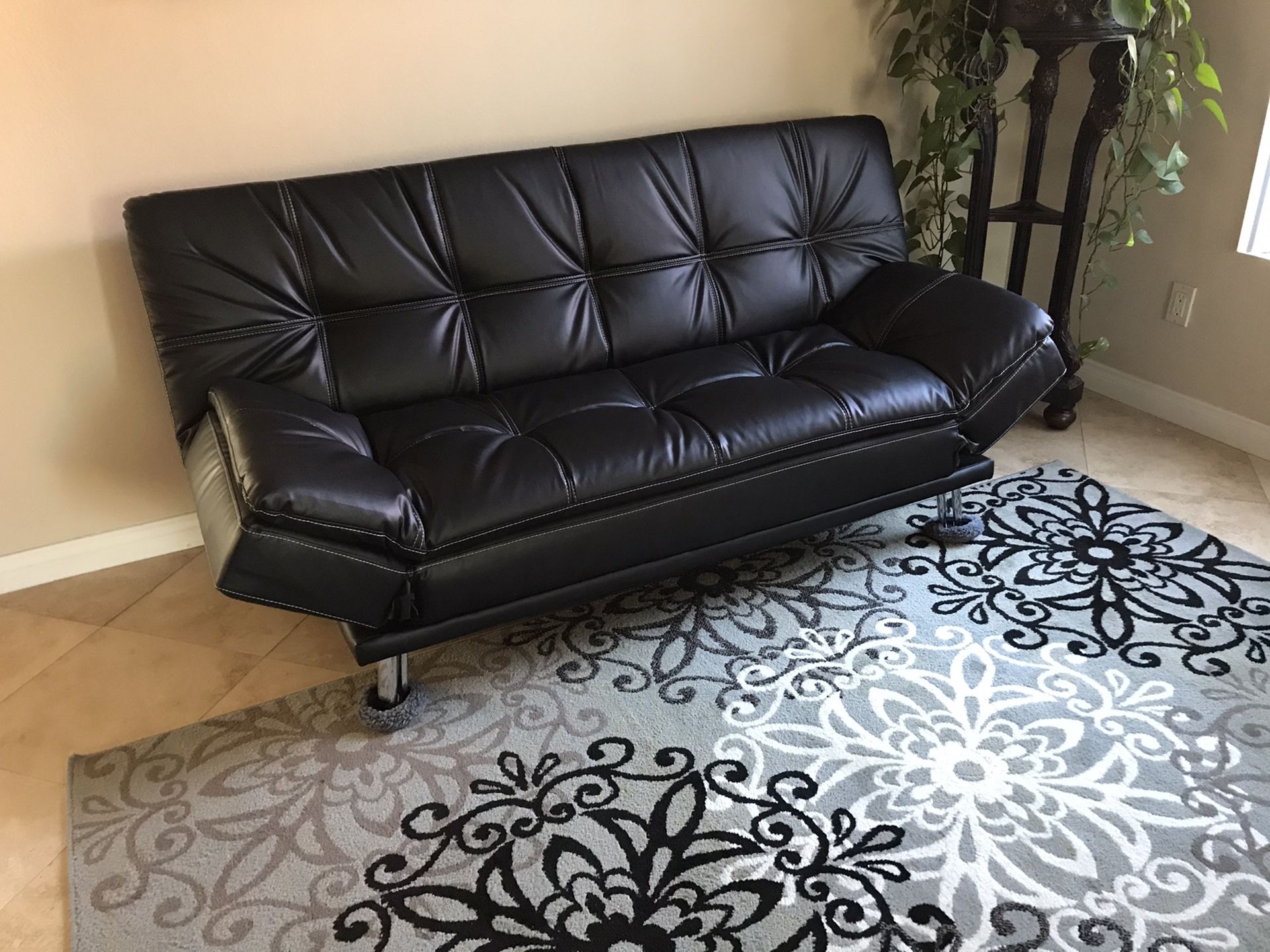 Beautiful brand new black leather sofa futon