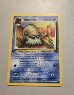 first edition Omanyte Pokémon card 52/62 Fossil 1999 TCG