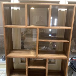Large bookshelf, dining room table, entertainment center