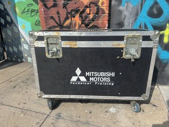 Large black anvil road case on wheels