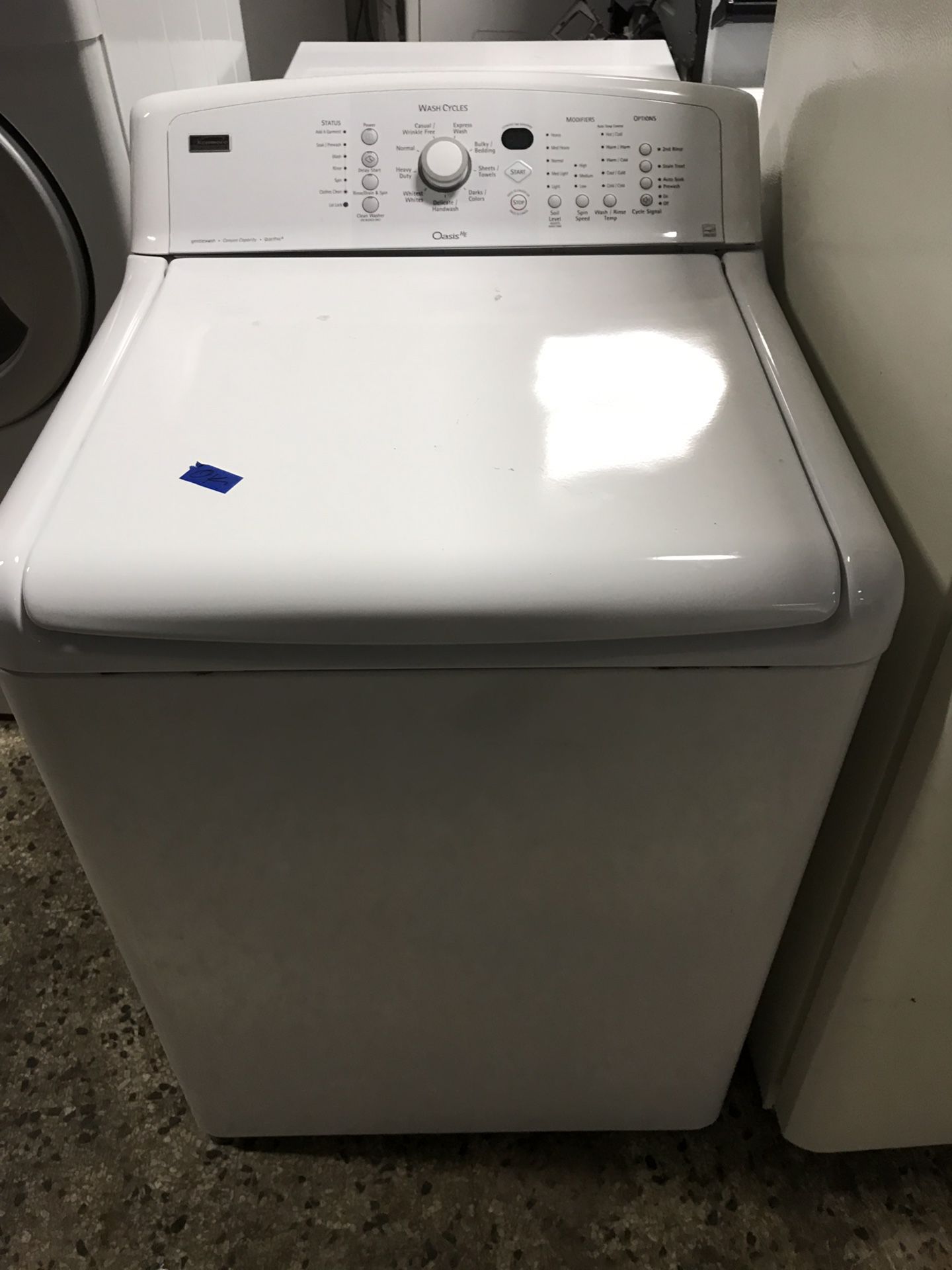 Kenmore brand refurbished top load washer dryer set.