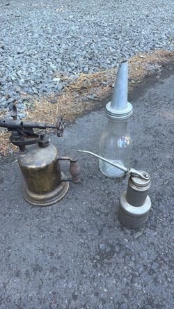 Vintage Oil dispenser with a vintage torch