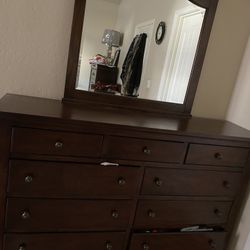 King Size Bed With A Dresser With Mirror And 2 Night Stands