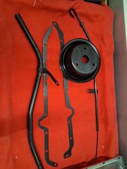 set of black powder-coated steel V-belt pulleys and brackets for a SBC