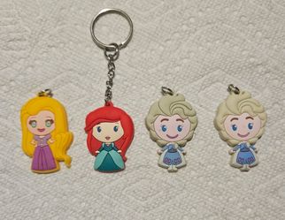 DISNEY LOT OF 4 PRINCESSES KEYCHAIN CHARMS APROX 2" PRE-OWNED IN GOOD COND.