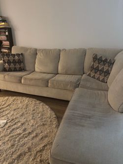 Sectional couch with a bed inside