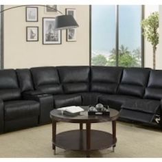 New Power Reclining Sectional .  Black Air Leather .  127” X 114”.  Free Delivery !