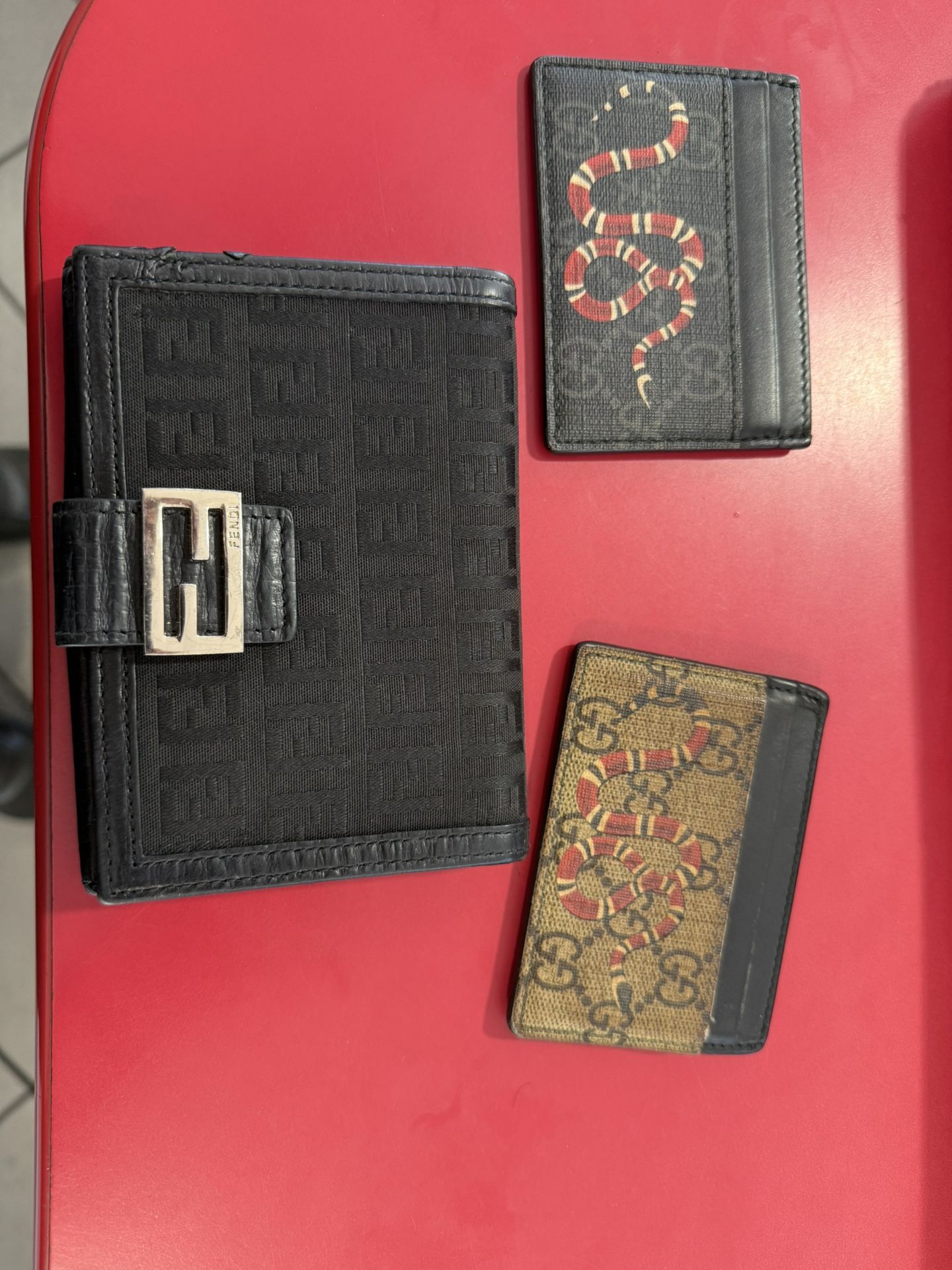 Two Gucci Cars Holders And A Fendi Wallet 