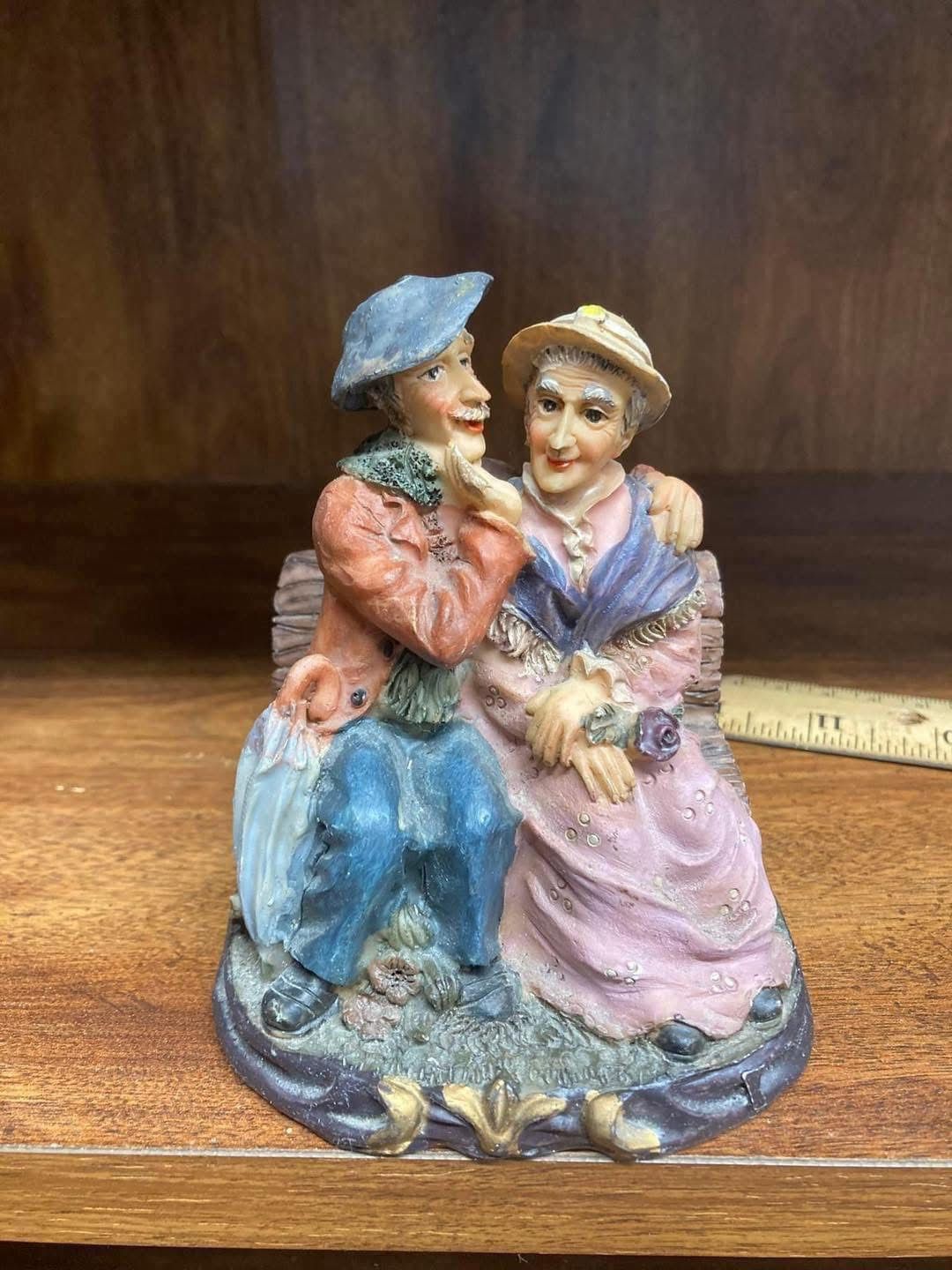 Sweet Loving Elderly Couple Sitting On A Bench Figurine