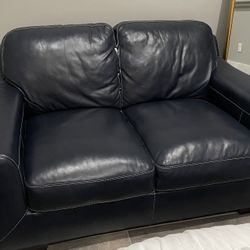 Blue leather loveseat 