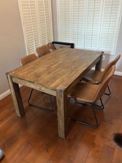 Free - 58 in wood table w four leather chairs (damaged)