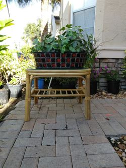 Small side bamboo/ratan table with artificial plant