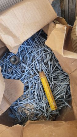 Large galvanized box of heavy duty nails