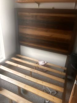 Queen size bed frame, headboard, sides, and footboard are mint condition