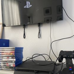 PlayStation 4 + 12 Games + Back Button Attachment + 2 Controllers + Charging Station