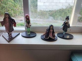 Demon slayer books and action figures