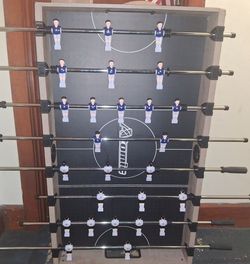 Foosball Table with Blue and White Players
