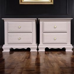 blush pink pair of wood refinished nightstands  