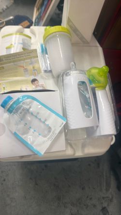 Baby bottles and disposable ones for feeding baby food